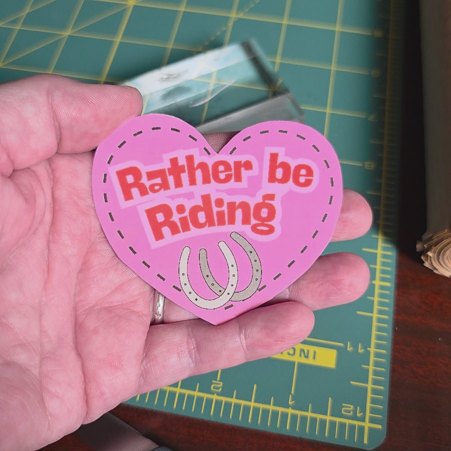 "Rather be Riding" heart sticker. 2.75 x 2.5 inches. Small size.
