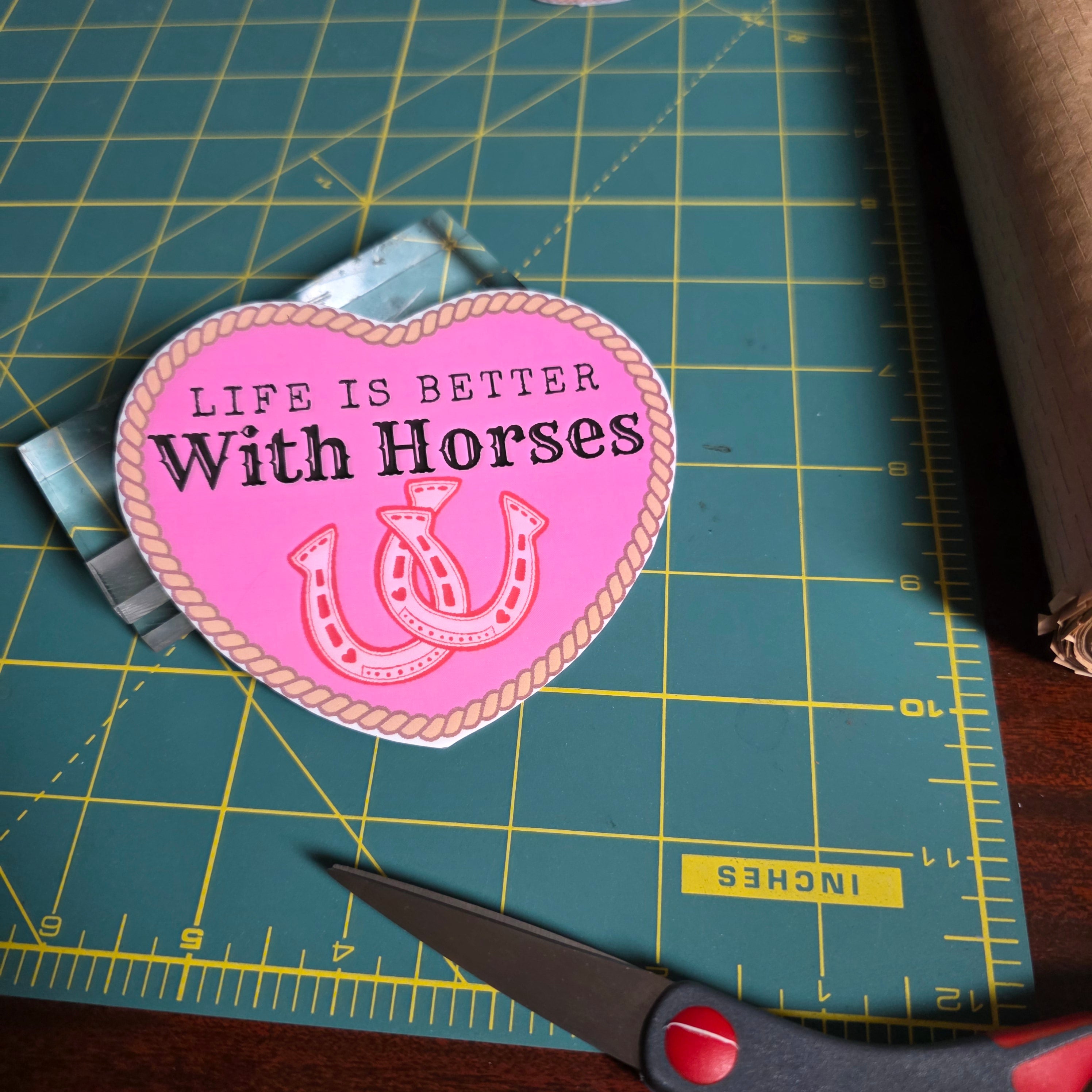 "Life is better with horses" 4 inch hot pink heart sticker.