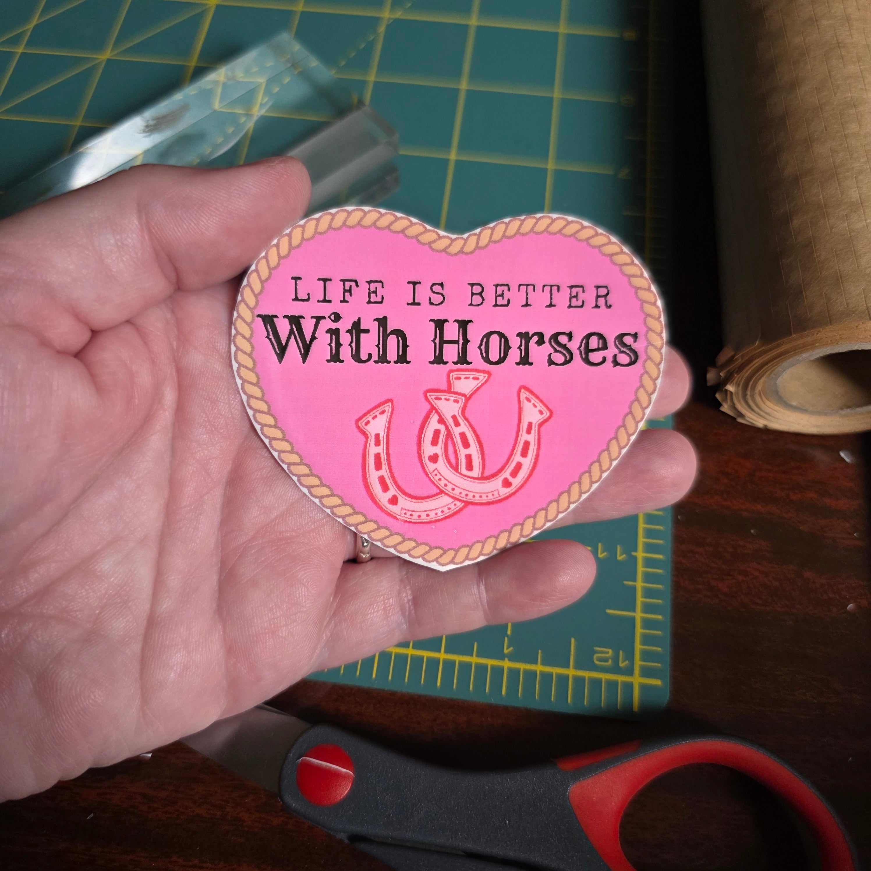 "Life is better with Horses" 3 x 2.75 inch light pink heart sticker. Small size.