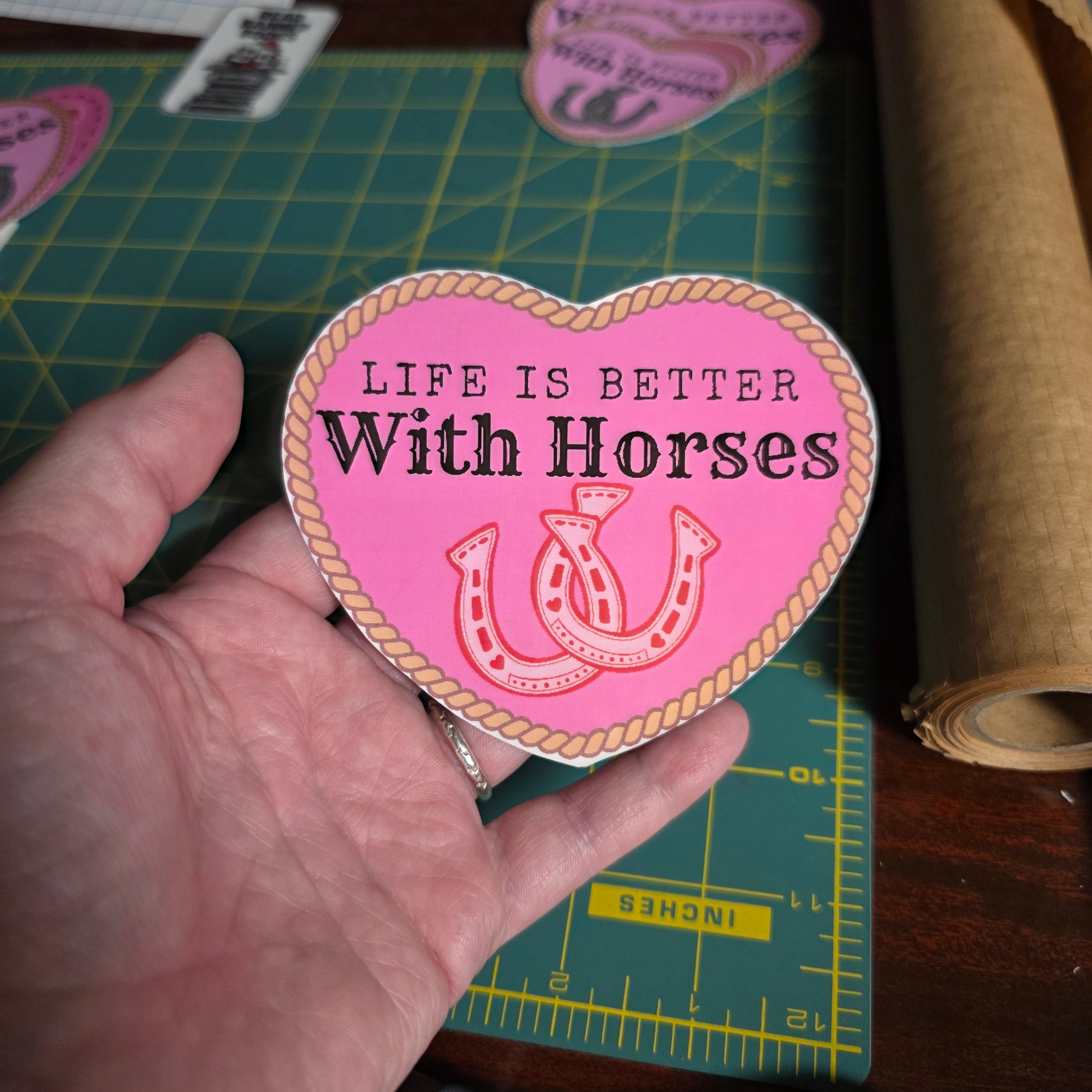 "Life is better with horses" 4 inch hot pink heart sticker.