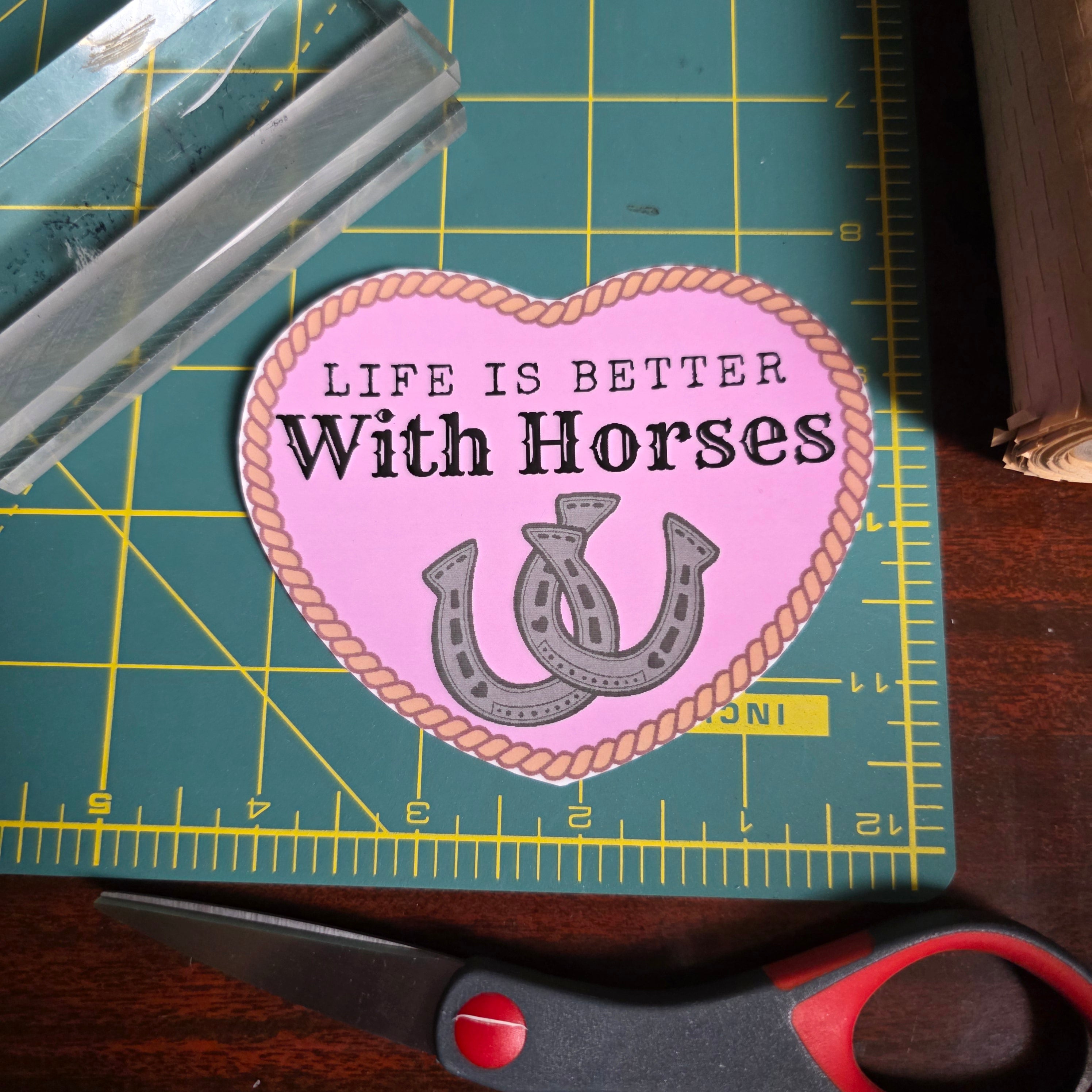 "Life is better with Horses" 4 inch light pink heart sticker.