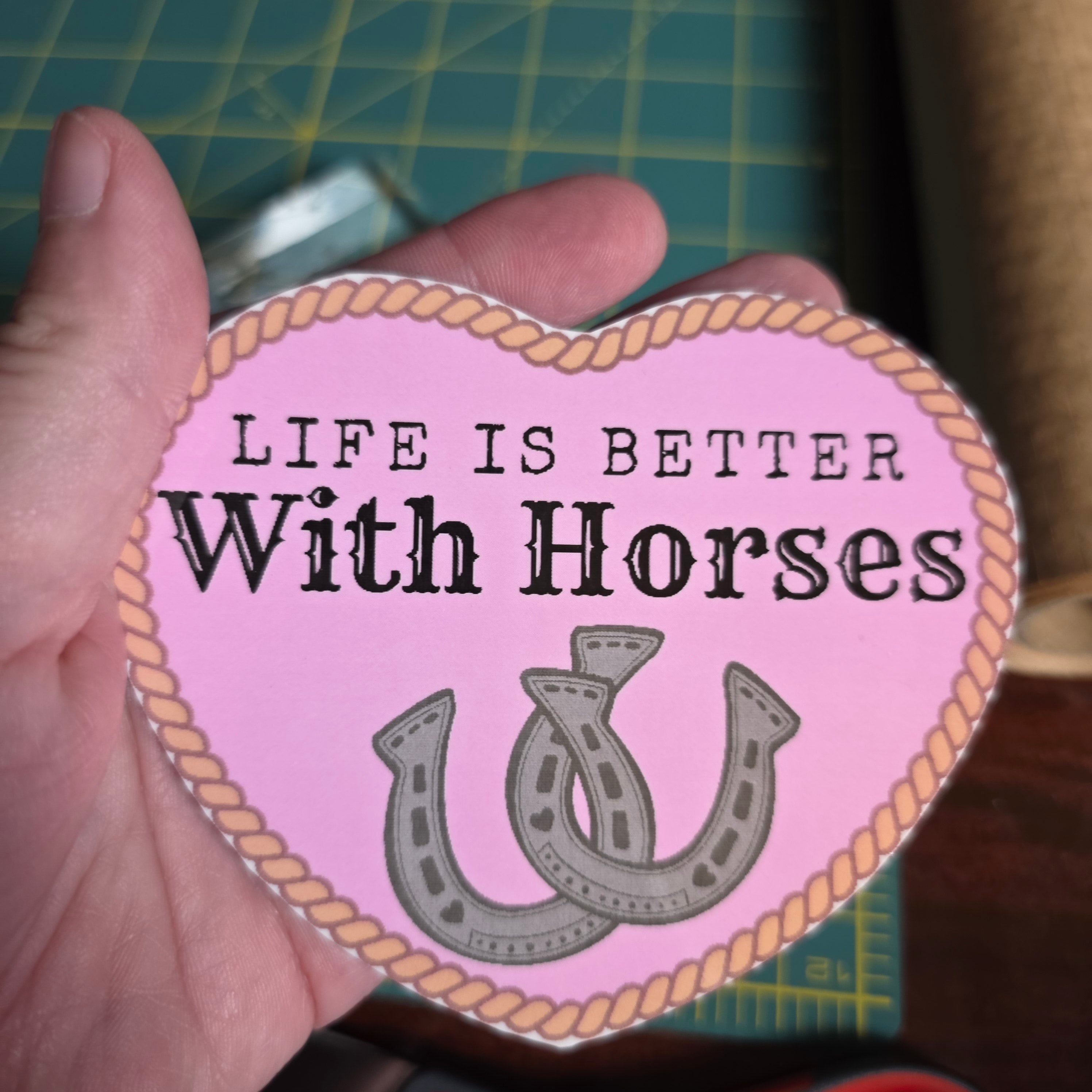 "Life is better with Horses" 4 inch light pink heart sticker.