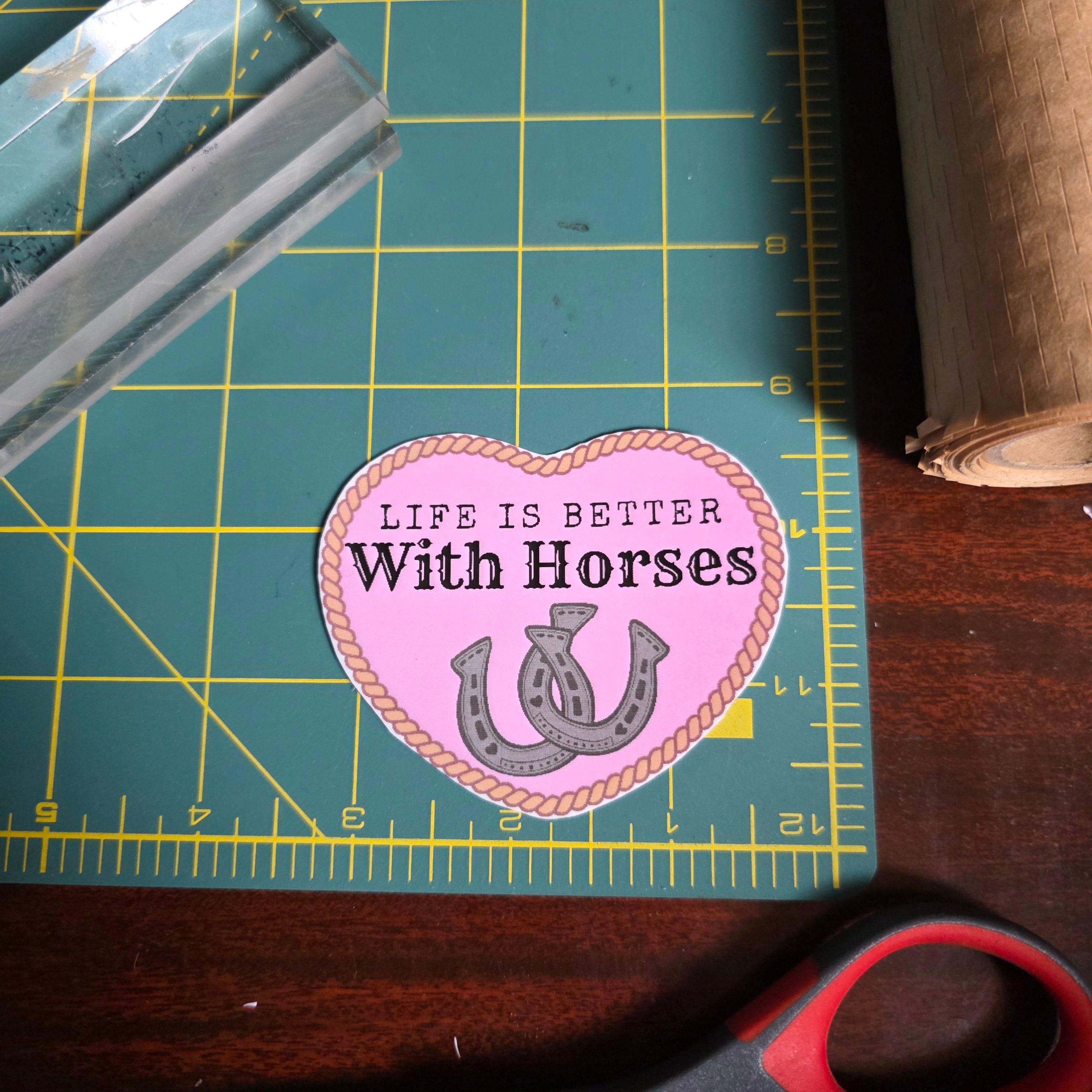 "Life is better with Horses" 3 x 2.75 inch light pink heart sticker. Small size.