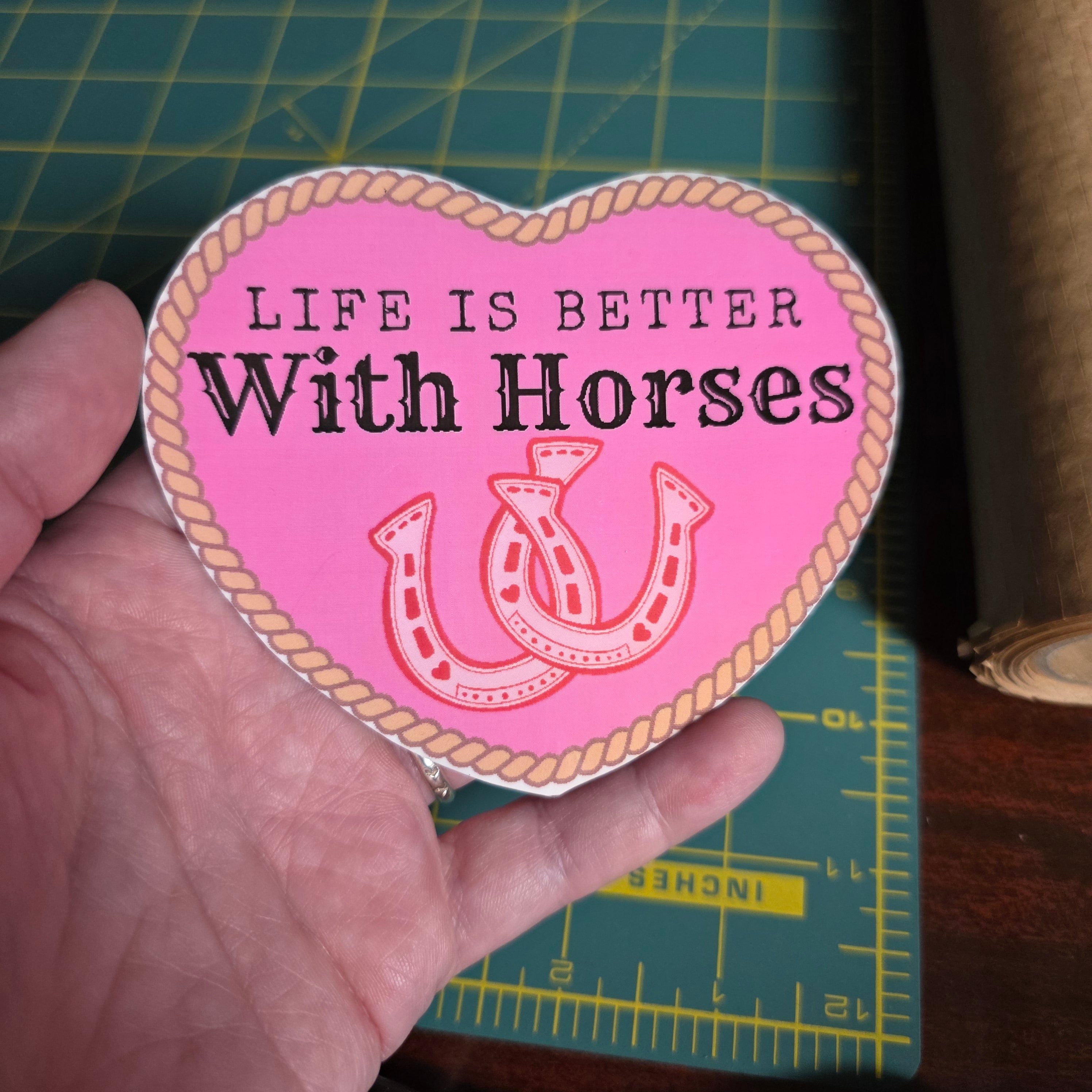 "Life is better with horses" 4 inch hot pink heart sticker.