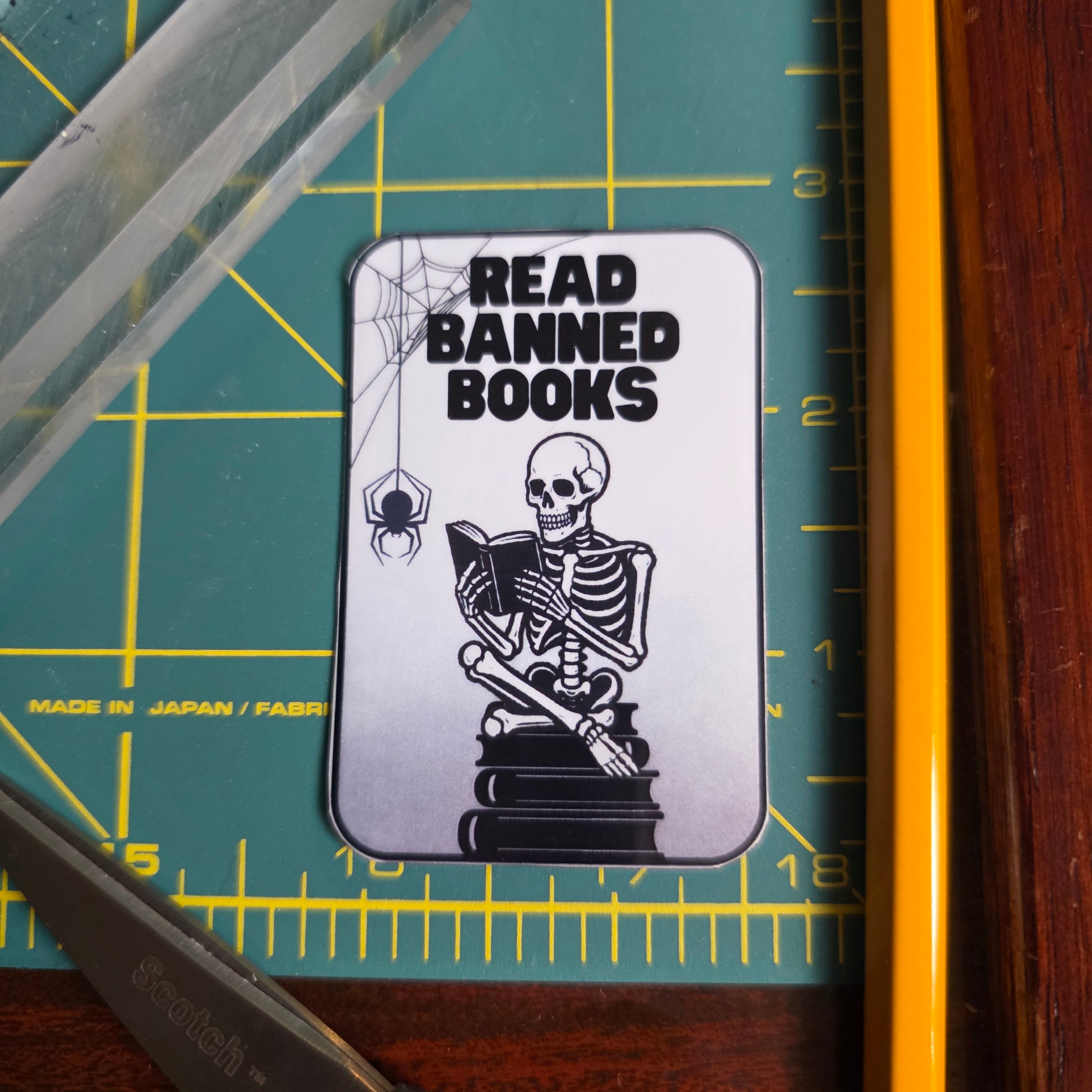 Skeleton and books "Read Banned Books"small sticker.