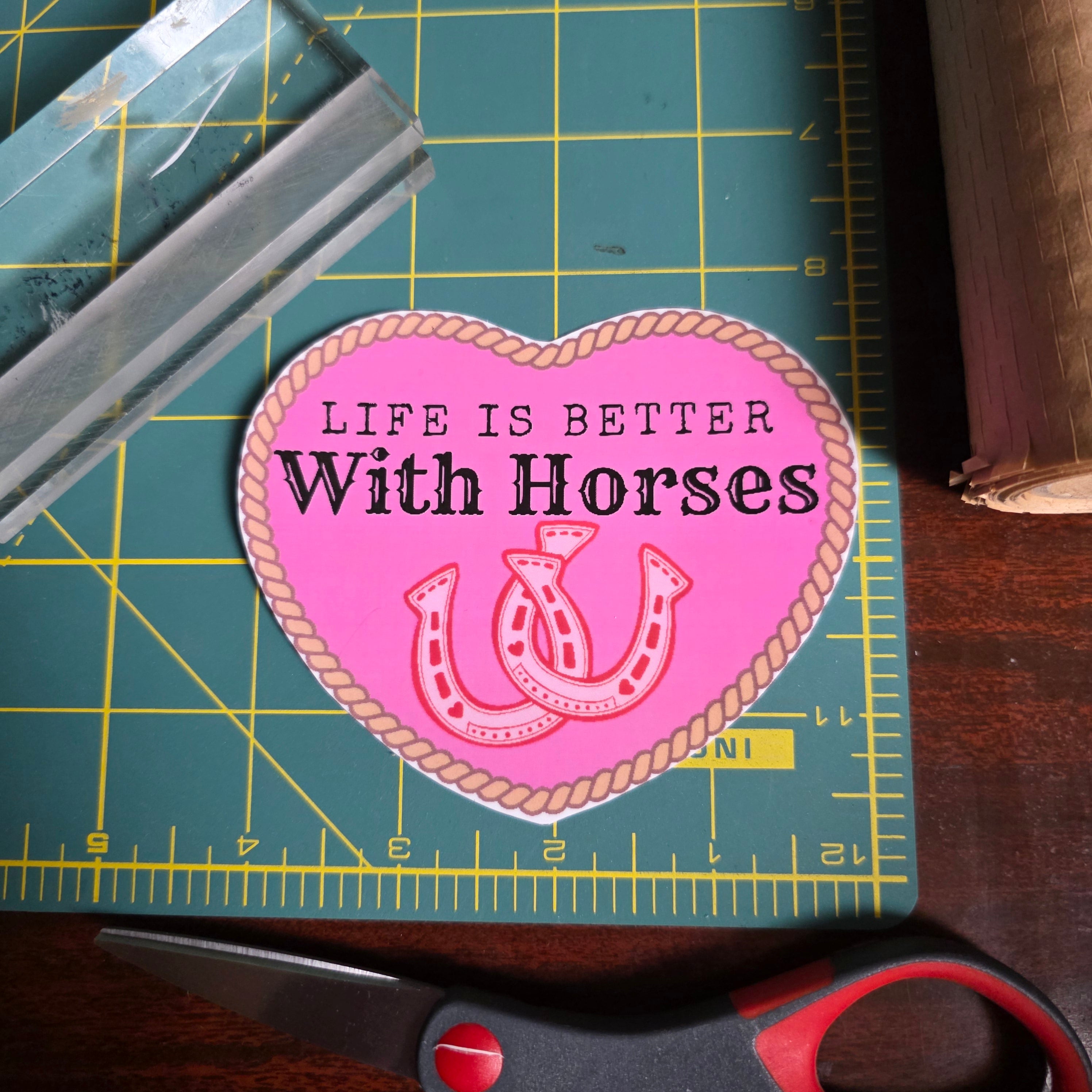 "Life is better with horses" 4 inch hot pink heart sticker.