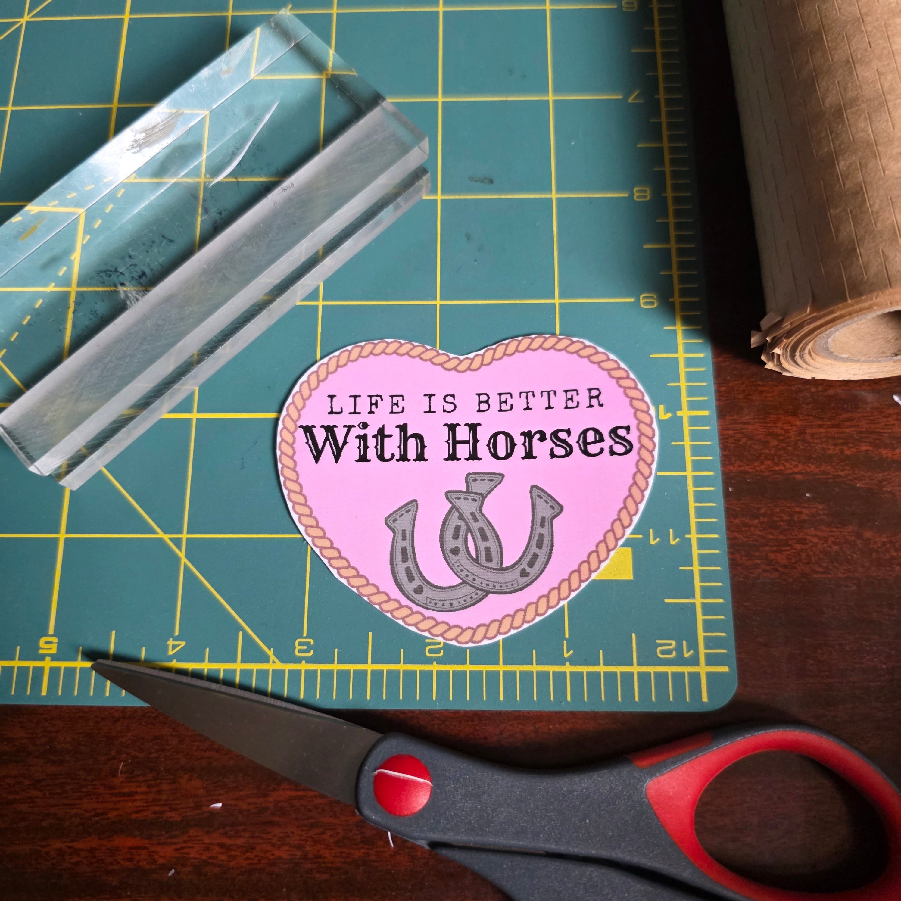"Life is better with Horses" 3 x 2.75 inch light pink heart sticker. Small size.