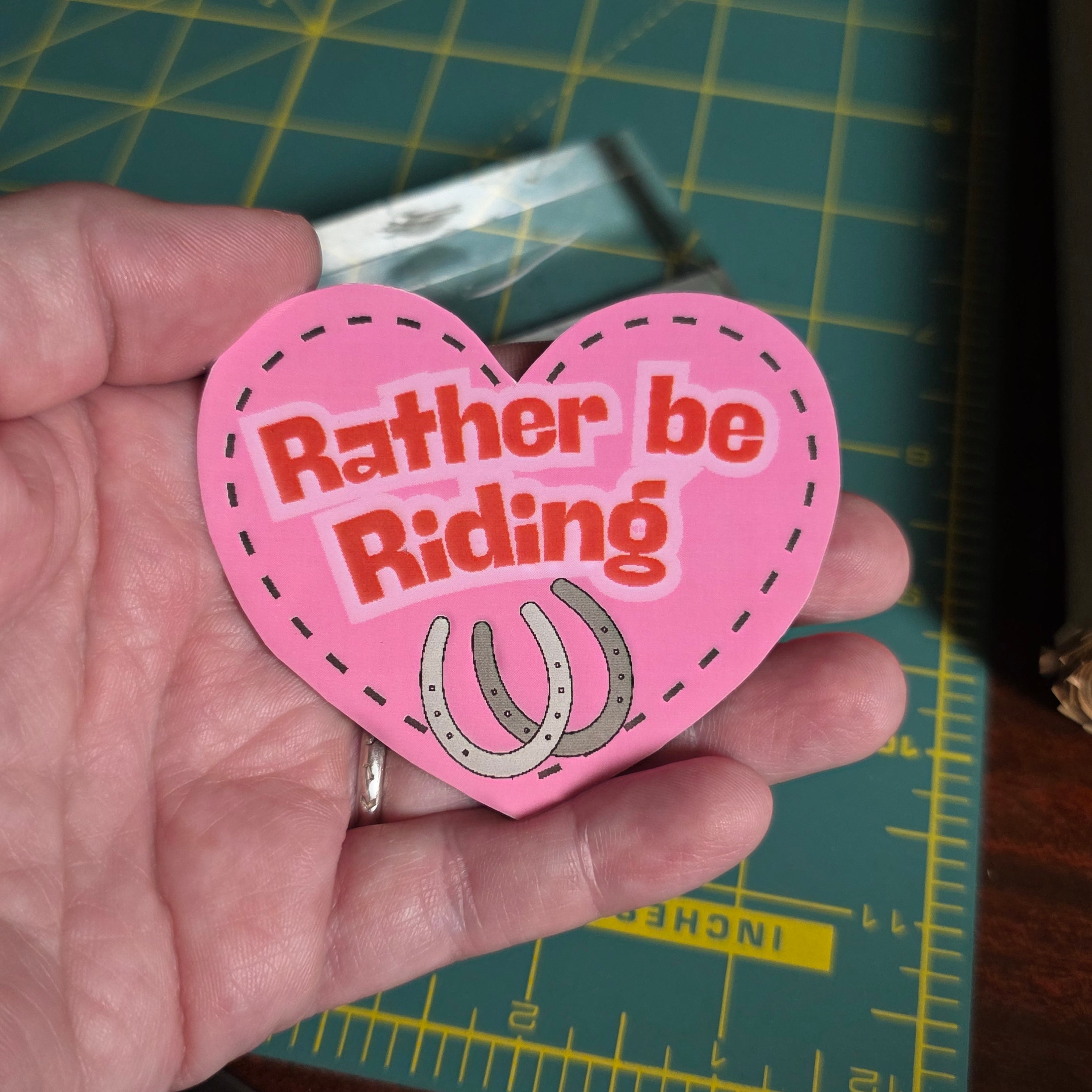"Rather be Riding" heart sticker. 2.75 x 2.5 inches. Small size.